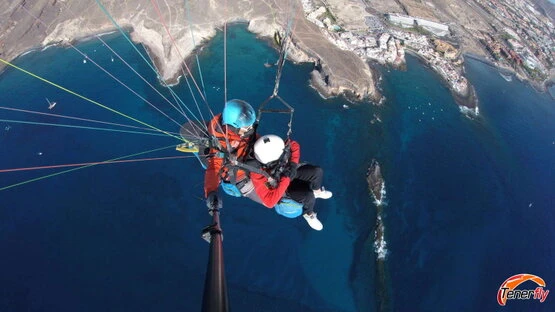 Explore the coast of Adeje, Tenerife, from the sky with this exciting paragliding view