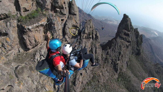 Paragliding over the volcanic rock gorges in Tenerife