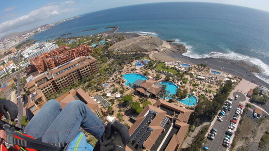 Excitement in the sand: Paragliding landing on the idyllic Playa de la Caleta in Tenerife